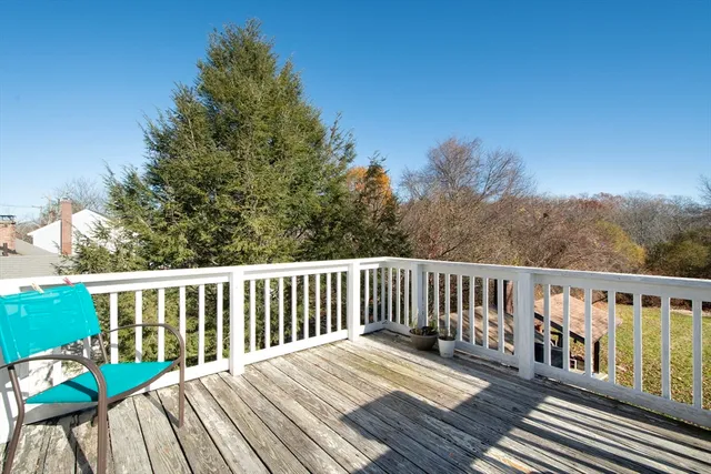a view of wooden deck and a yard