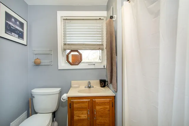 a bathroom with a toilet and a sink