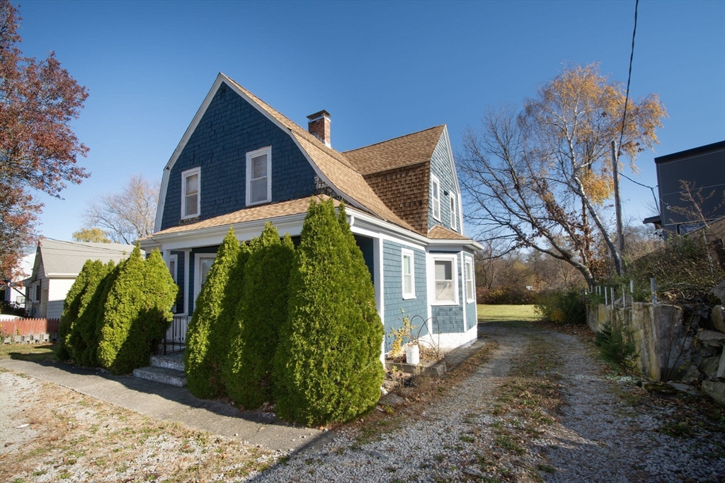 972 Liberty Street Braintree, MA 02184 - Photo 2 of 28 a view of a house with a yard