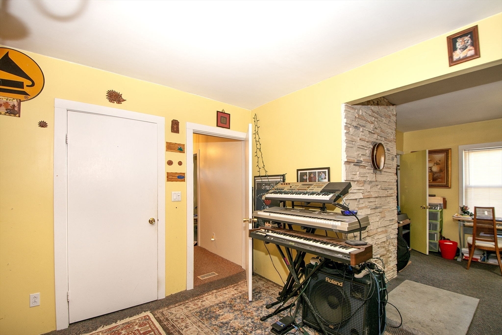 972 Liberty Street Braintree, MA 02184 - Photo 21 of 28 a kitchen with a refrigerator and a stove