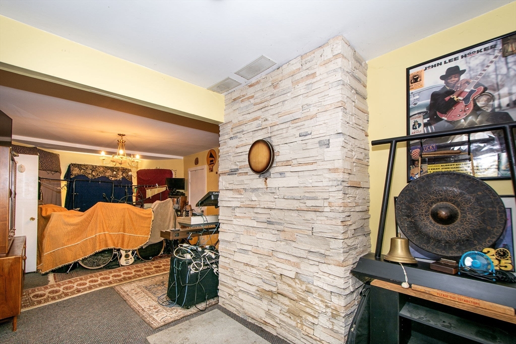 972 Liberty Street Braintree, MA 02184 - Photo 22 of 28 a bedroom with a door and a bed