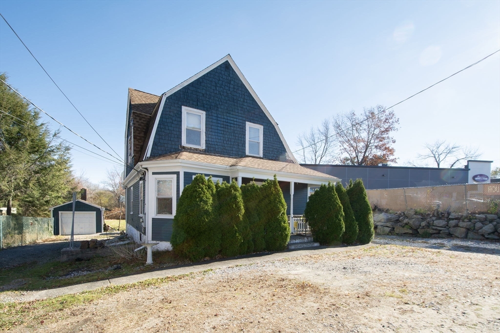 972 Liberty Street Braintree, MA 02184 - Photo 4 of 28 a front view of a house with a yard
