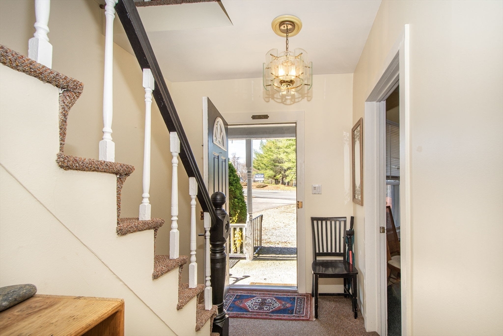 972 Liberty Street Braintree, MA 02184 - Photo 7 of 28 a view of a livingroom with furniture staircase and front door