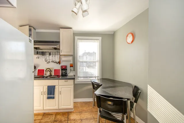 a kitchen with stainless steel appliances granite countertop a stove and a refrigerator