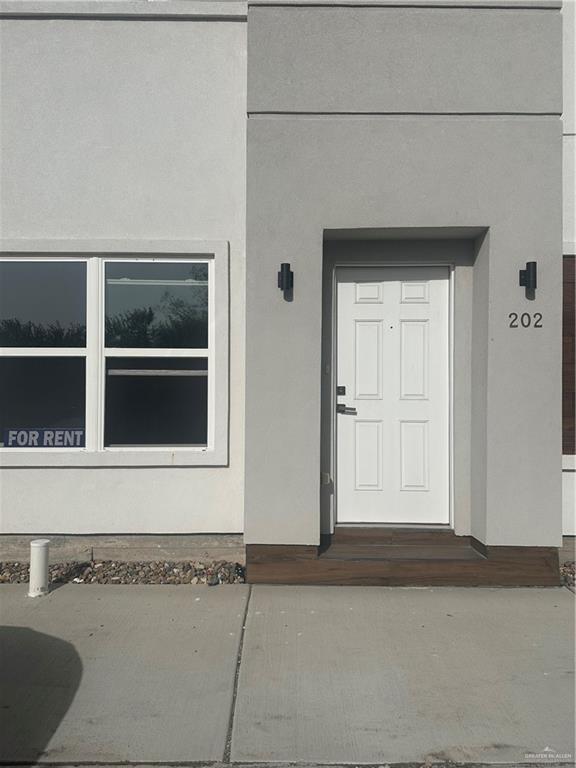 901 Yuma Avenue, Unit 202 McAllen, TX 78503 - Photo 2 of 11 a view of a door and a window