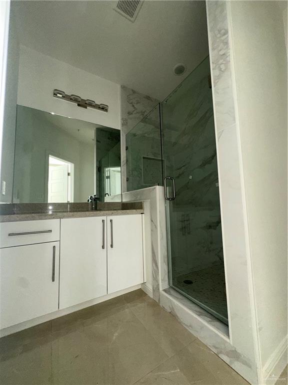 901 Yuma Avenue, Unit 202 McAllen, TX 78503 - Photo 6 of 11 a bathroom with a shower and a sink