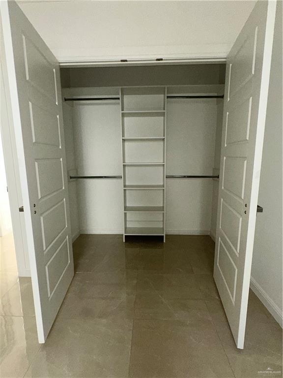 901 Yuma Avenue, Unit 202 McAllen, TX 78503 - Photo 7 of 11 a view of a room with an empty walk in closet