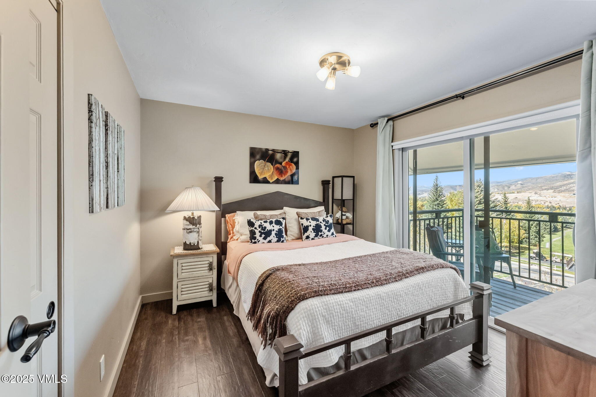 596 Daisy Lane, Unit 10 Avon, CO 81620 - Photo 11 of 34 a bedroom with a large bed and a window