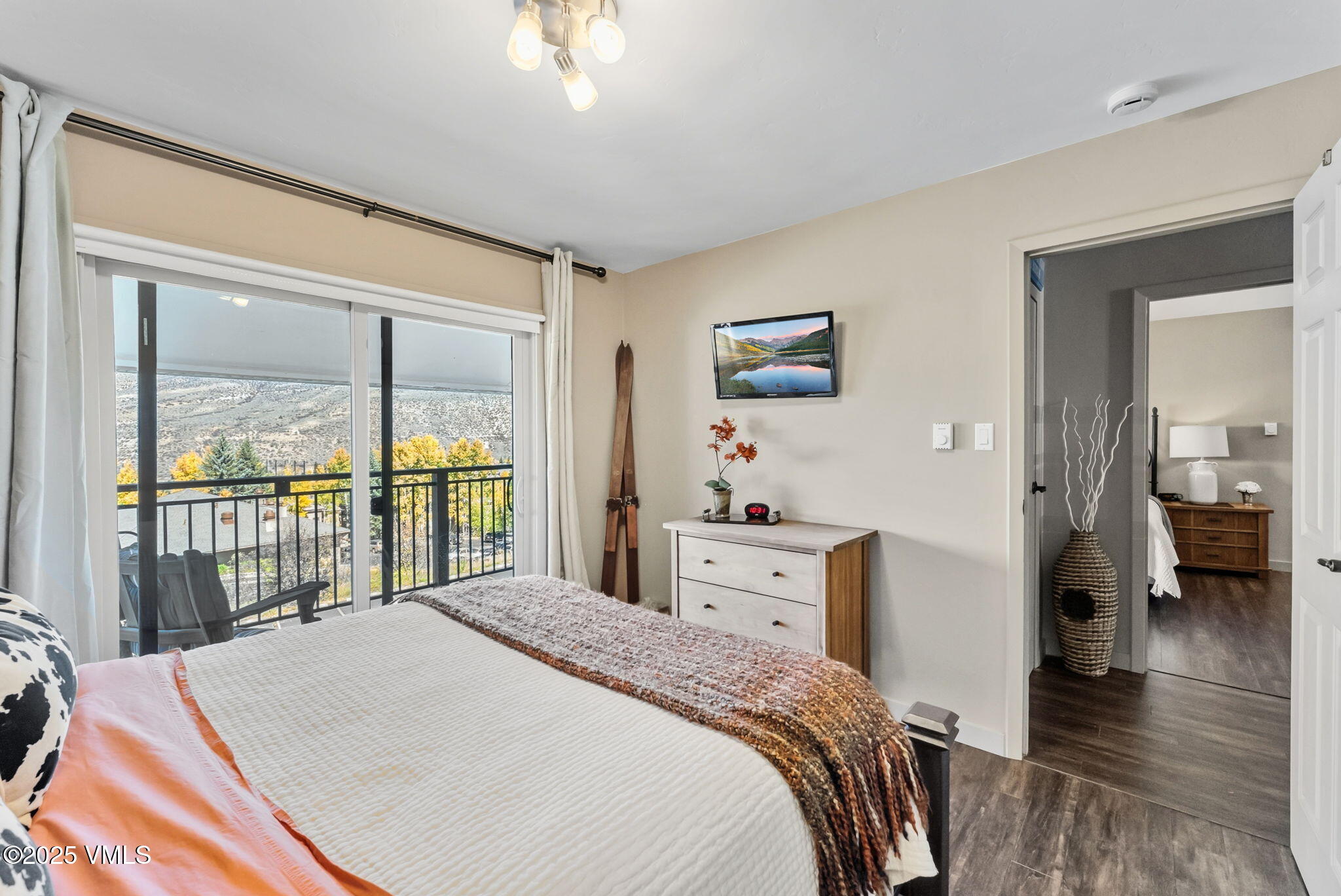 596 Daisy Lane, Unit 10 Avon, CO 81620 - Photo 12 of 34 a bedroom with a bed and a large window