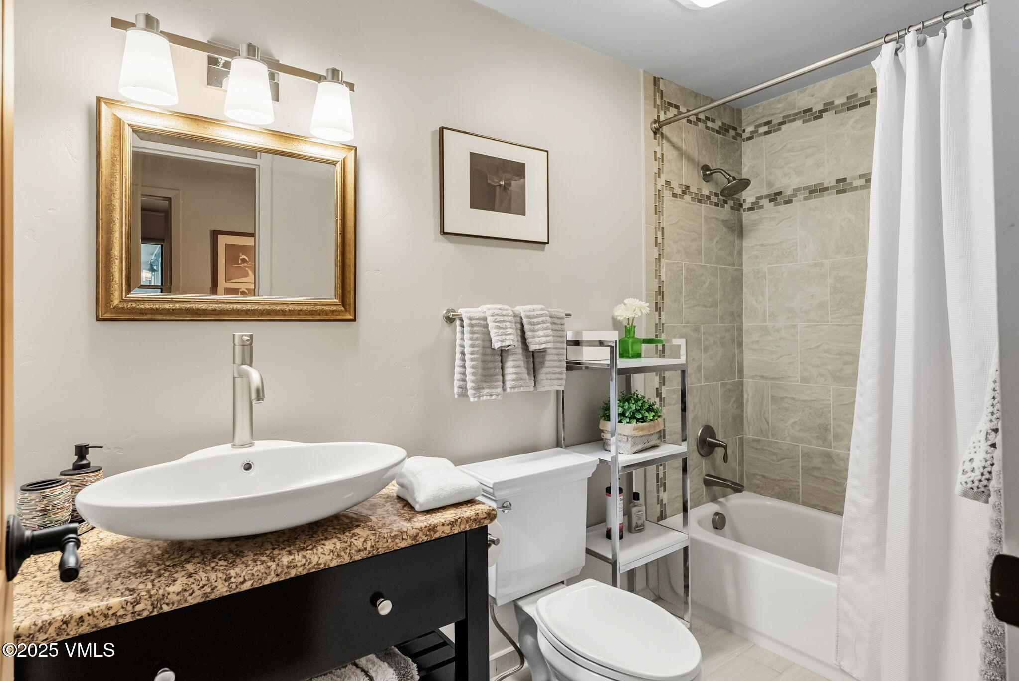 596 Daisy Lane, Unit 10 Avon, CO 81620 - Photo 13 of 34 a bathroom with a granite countertop sink toilet and shower
