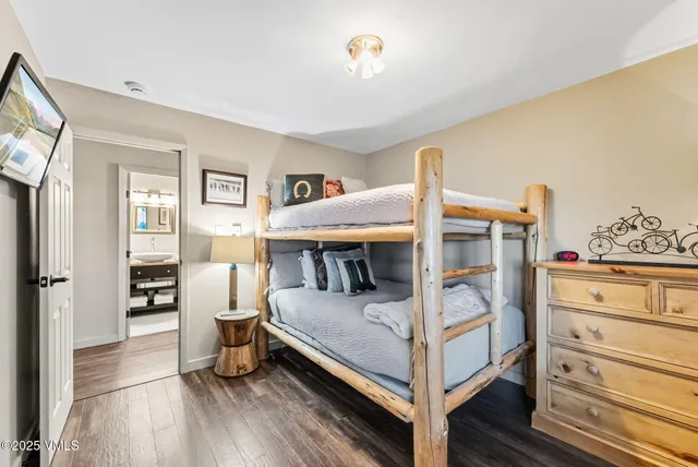 a bedroom with furniture and white walls
