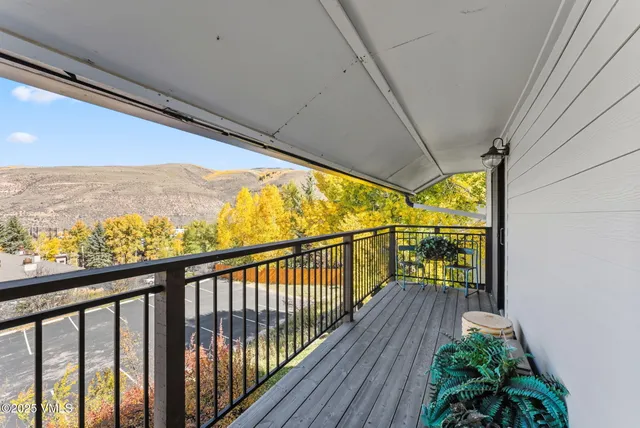 a view of balcony with wooden floor