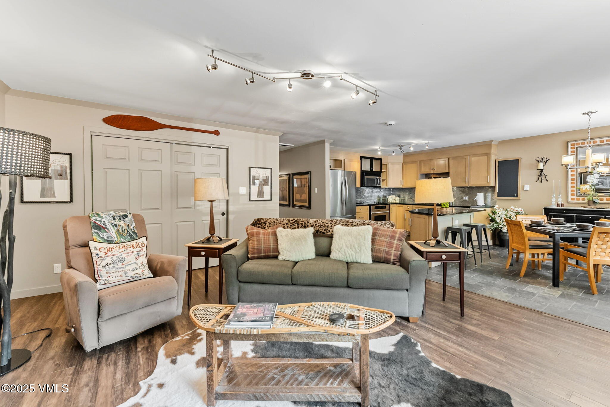 596 Daisy Lane, Unit 10 Avon, CO 81620 - Photo 2 of 34 a living room with furniture kitchen view and a wooden floor
