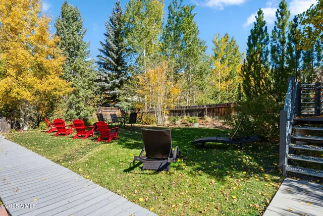 a view of a garden with sitting area