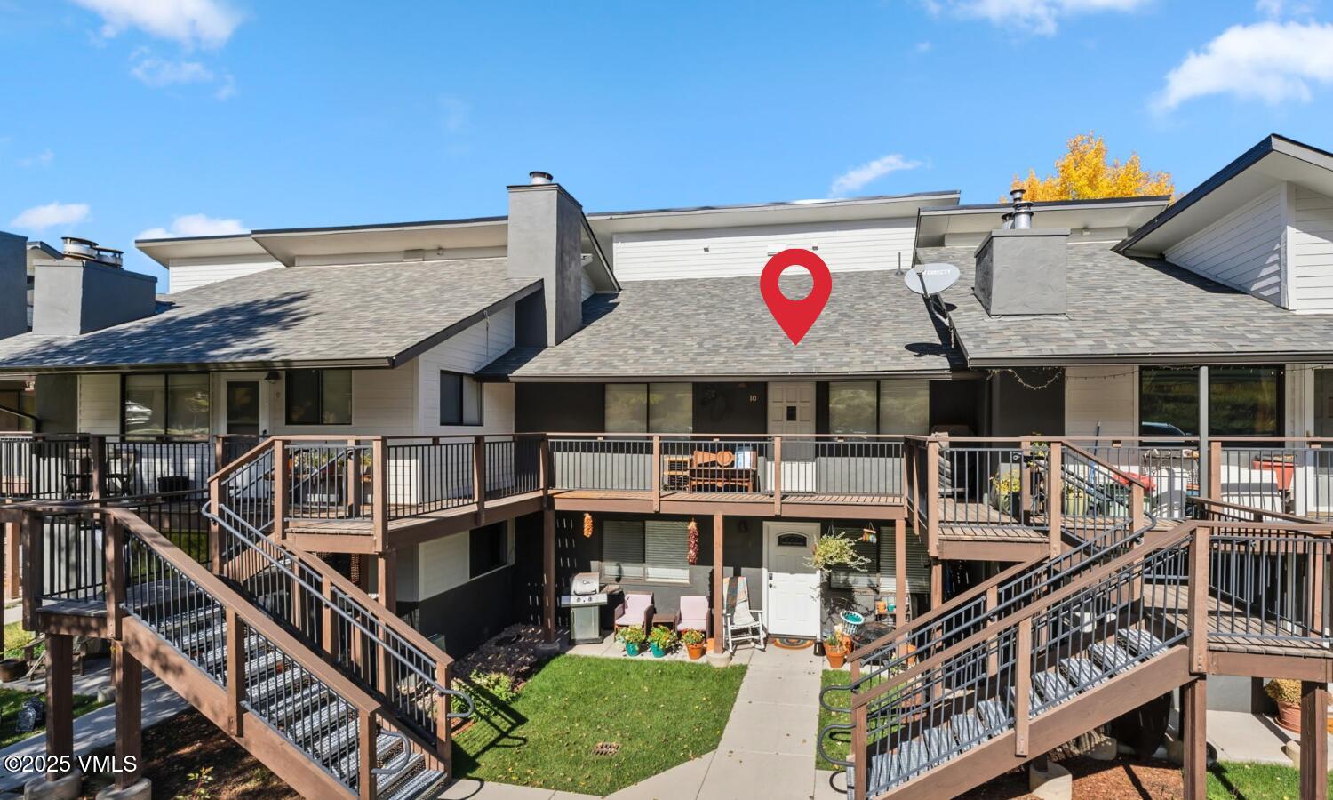 596 Daisy Lane, Unit 10 Avon, CO 81620 - Photo 24 of 34 a view of large house with large windows and a table