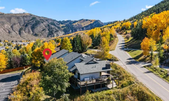 a view of a swimming pool with a yard