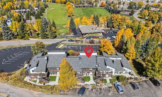 an aerial view of houses with outdoor space