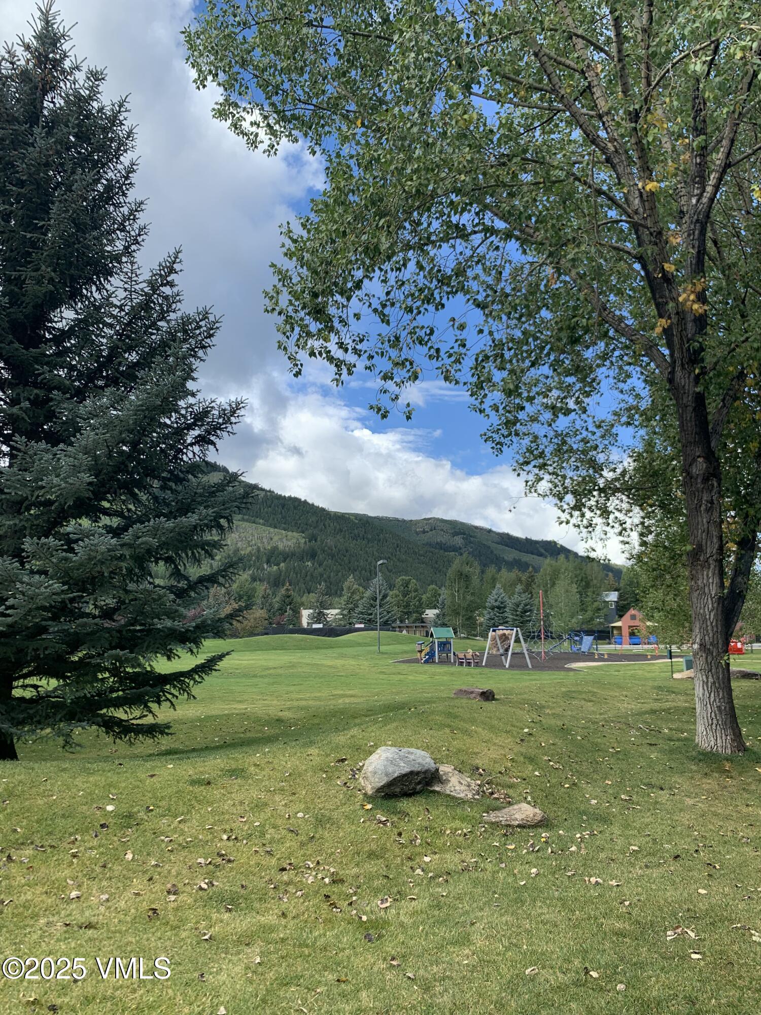 596 Daisy Lane, Unit 10 Avon, CO 81620 - Photo 31 of 34 a view of a golf course with a lake