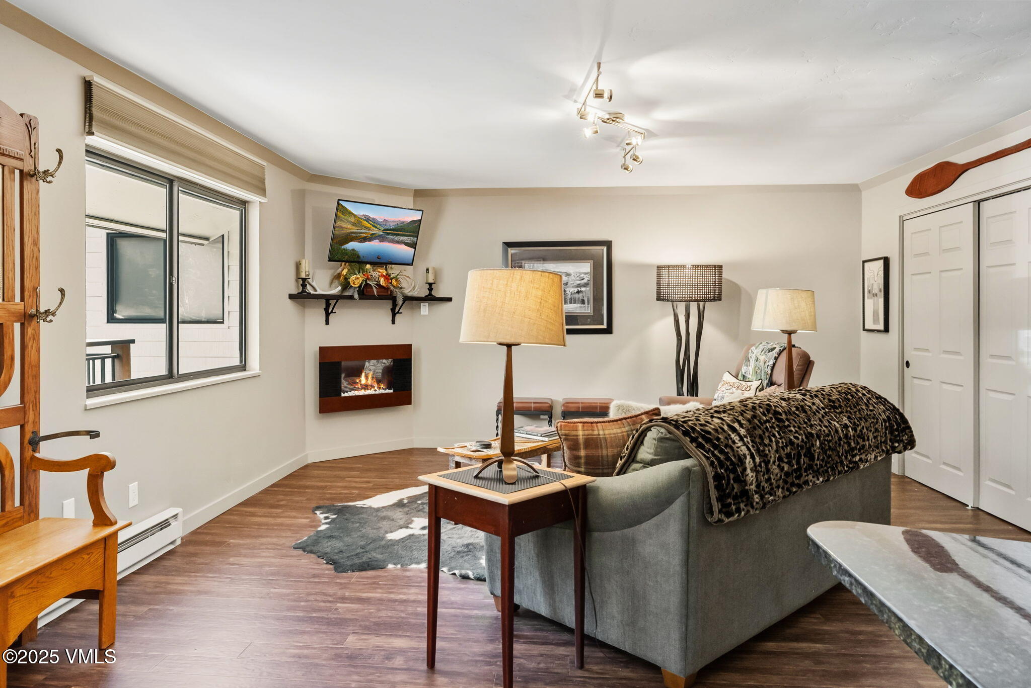 596 Daisy Lane, Unit 10 Avon, CO 81620 - Photo 5 of 34 a living room with furniture and a wooden floor