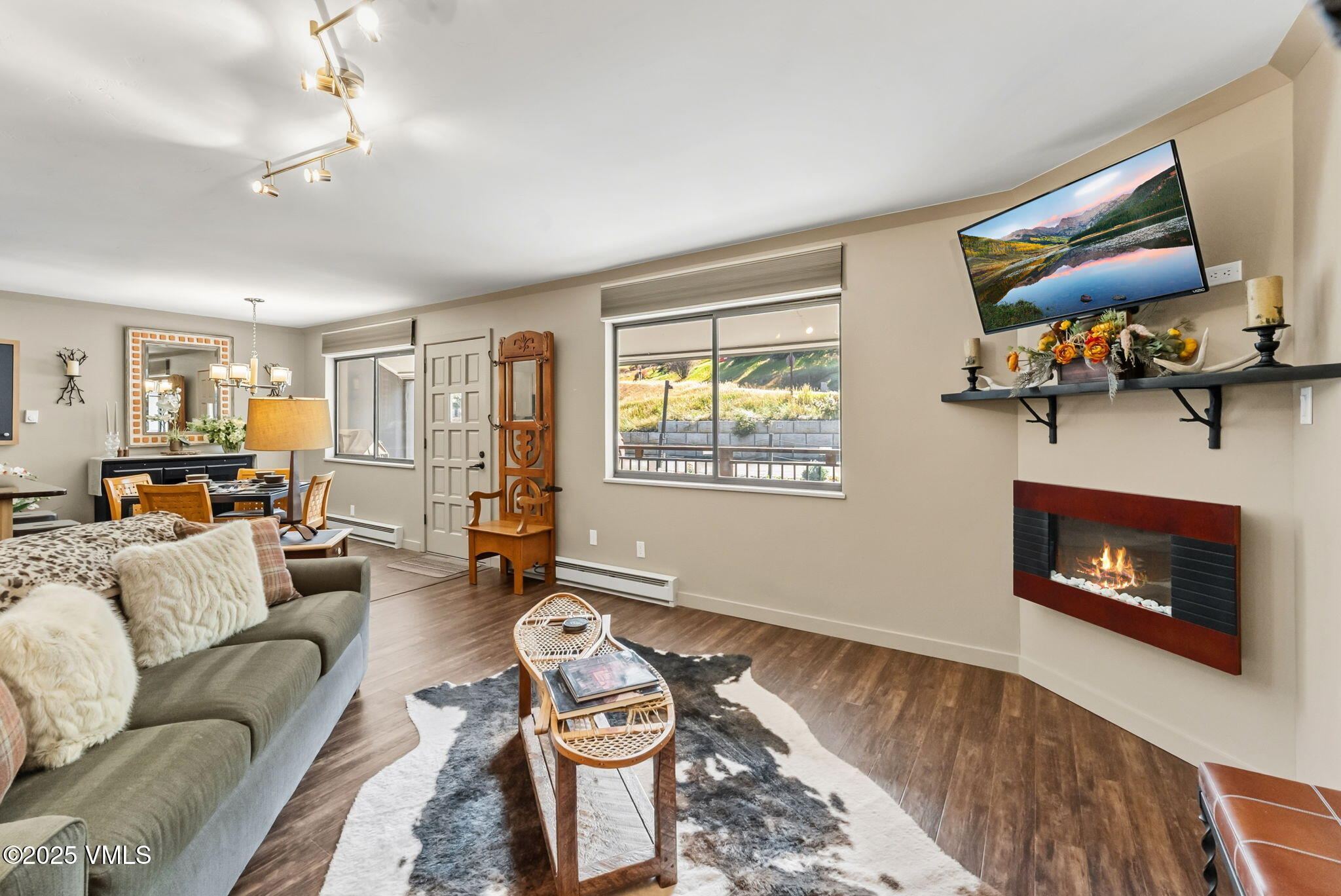 596 Daisy Lane, Unit 10 Avon, CO 81620 - Photo 7 of 34 a living room with furniture and a fireplace