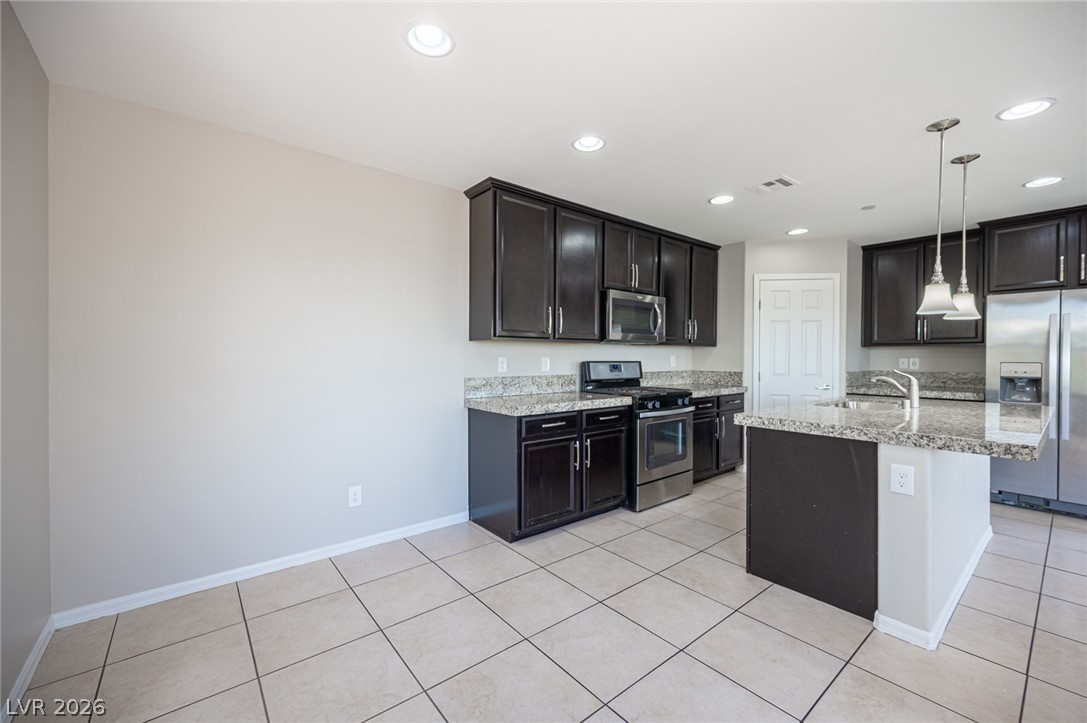 9916 Sable Point Street Las Vegas, NV 89178 - Photo 42 of 73 Culinary aspirations find a home with stainless steel appliances and abundant counter space.