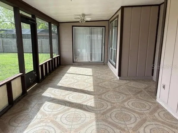 a view of an empty room with a large window