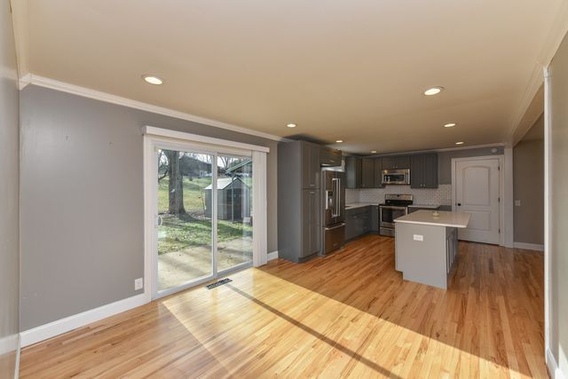 a view of a kitchen with wooden floor