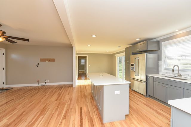 a room with wooden floor and entrance