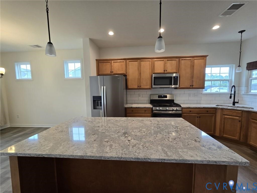 7825 Old Guild Road Richmond, VA 23237 - Photo 10 of 27 Kitchen featuring a large island with stone counte