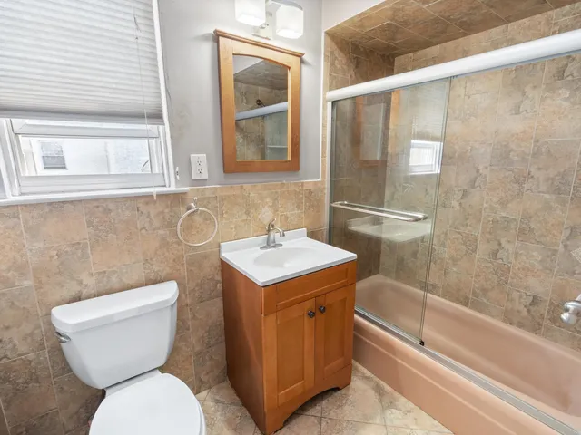 a bathroom with a toilet a sink and a bathtub