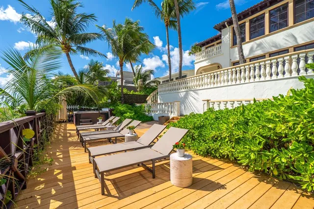 a view of a backyard with swimming pool