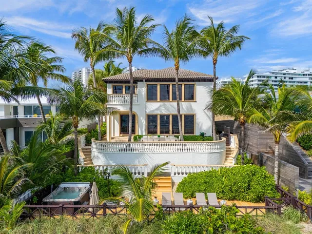 a view of a chairs and table in the balcony
