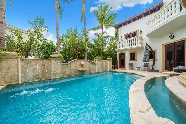 a spacious bedroom with a large bed and a couch