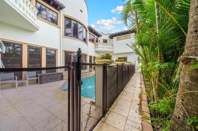 a bedroom with a large bed and a large window