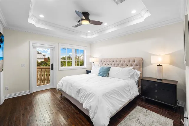 a bedroom with a large bed and a large window