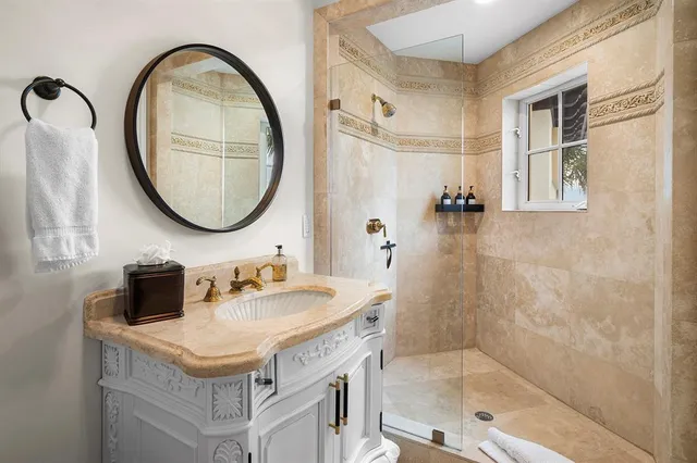 a bathroom with a sink and a mirror