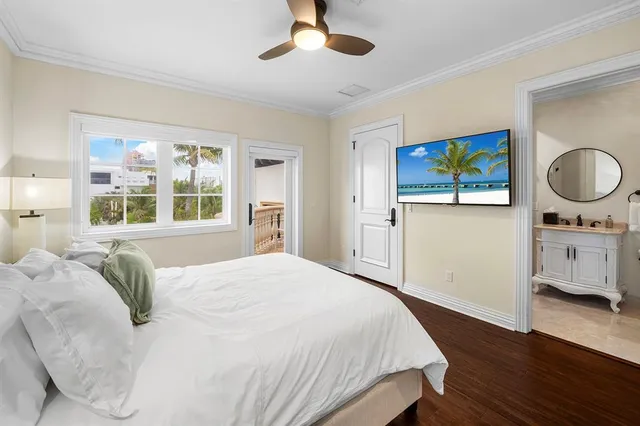 a bedroom with a bed and a mirror