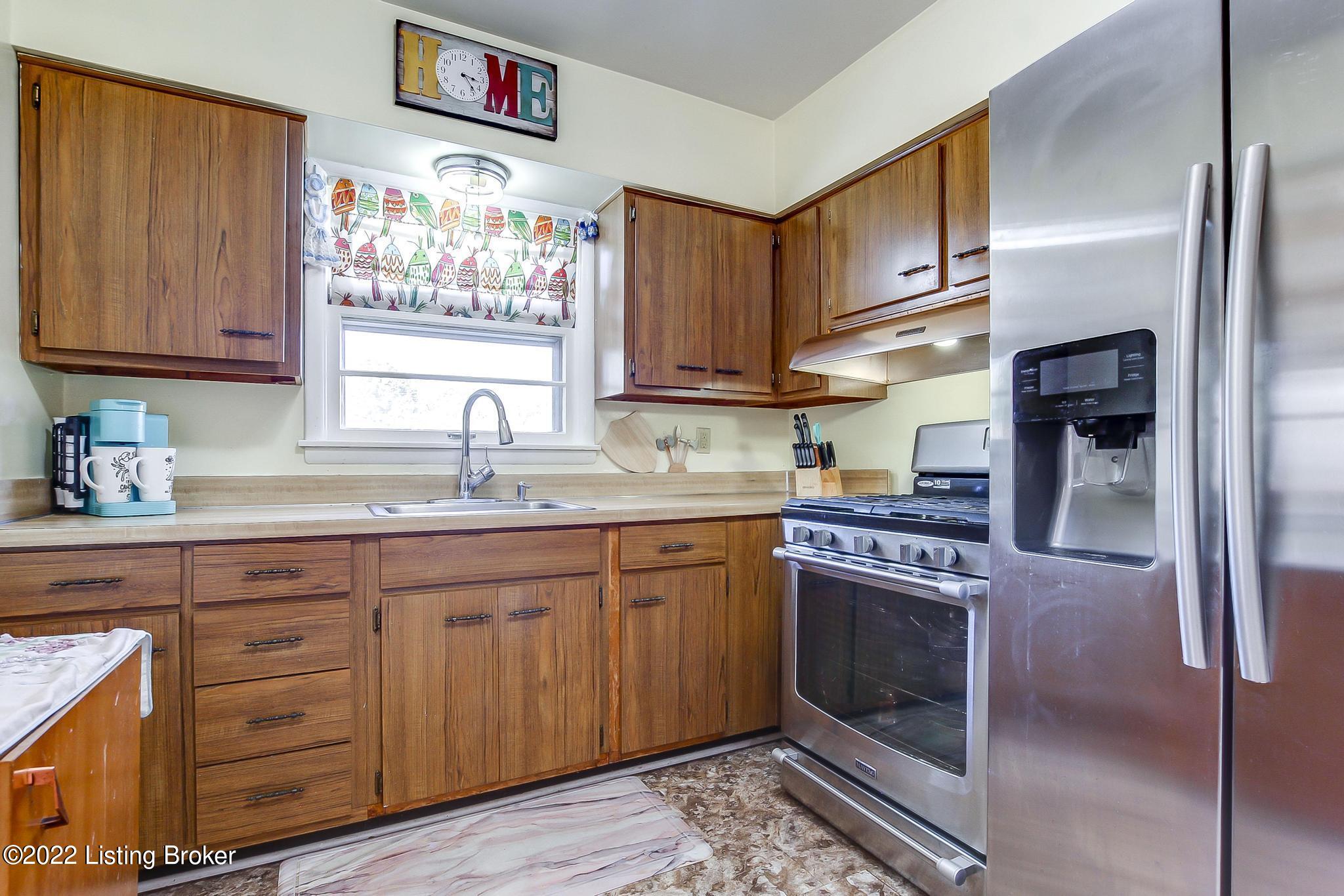 3718 Rouge Way Louisville, KY 40218 - Photo 6 of 27 Nice kitchen that opens to screened porch.