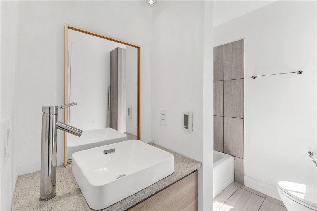 712 Banks Street Bryan, TX 77803 - Photo 20 of 33 a bathroom with a sink a toilet and shower