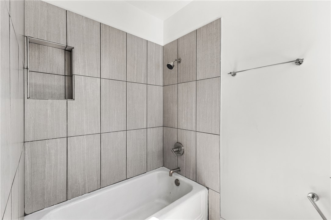 712 Banks Street Bryan, TX 77803 - Photo 21 of 33 a bathroom with a bathtub and shower