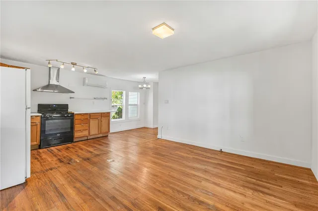 a view of kitchen with wooden floor