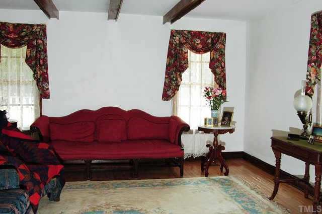 13201 Old Creedmoor Road Raleigh, NC 27613 - Photo 3 of 10 a living room with furniture and a window