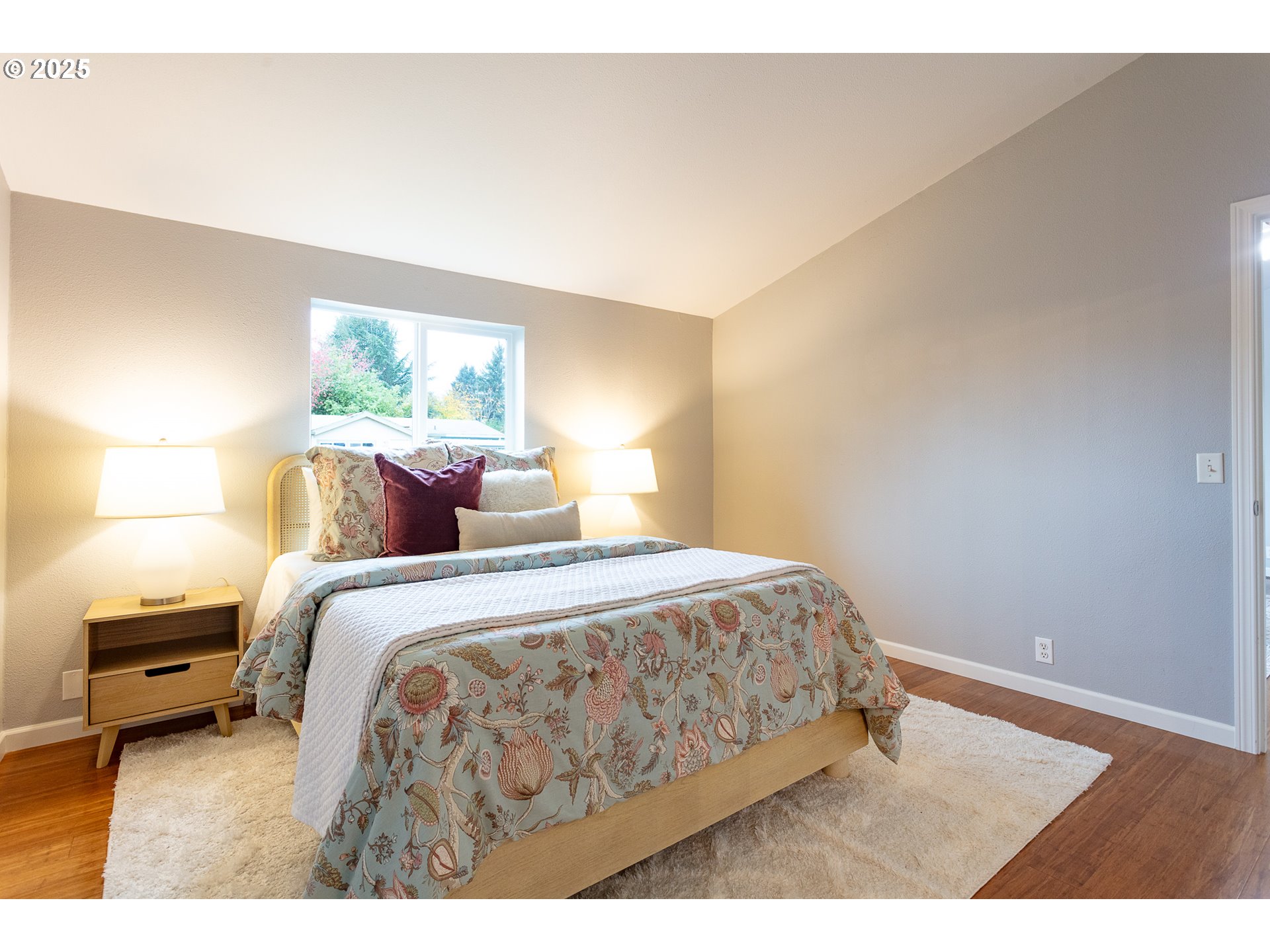 2655 Atticus Way Eugene, OR 97404 - Photo 15 of 27 a bedroom with a bed a window and a lamp