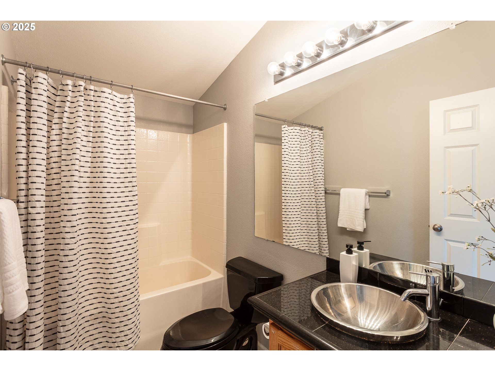 2655 Atticus Way Eugene, OR 97404 - Photo 21 of 27 a bathroom with a sink a bathtub and a mirror