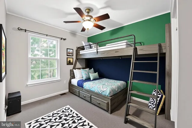 a bedroom with a bed and windows