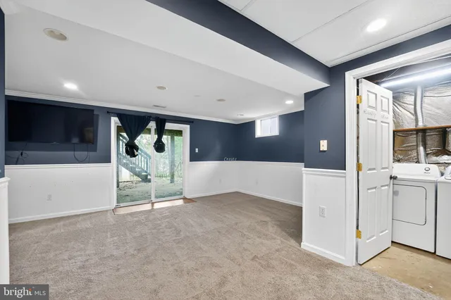 a view of a livingroom with kitchen and furniture