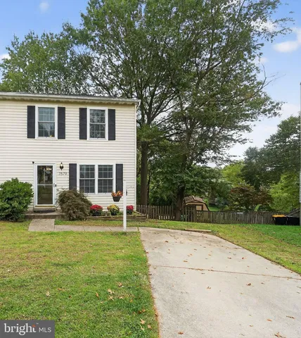 a view of house with yard