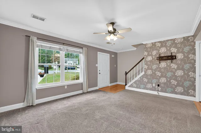 a view of an empty room with a window