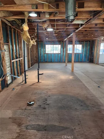 a view of empty room with floor to ceiling window