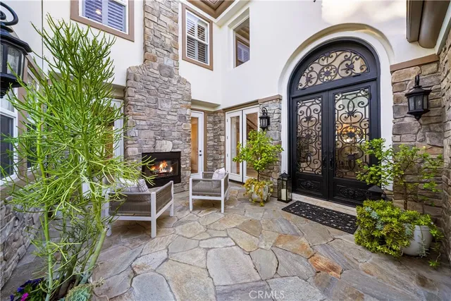 a living room with furniture fireplace and a table